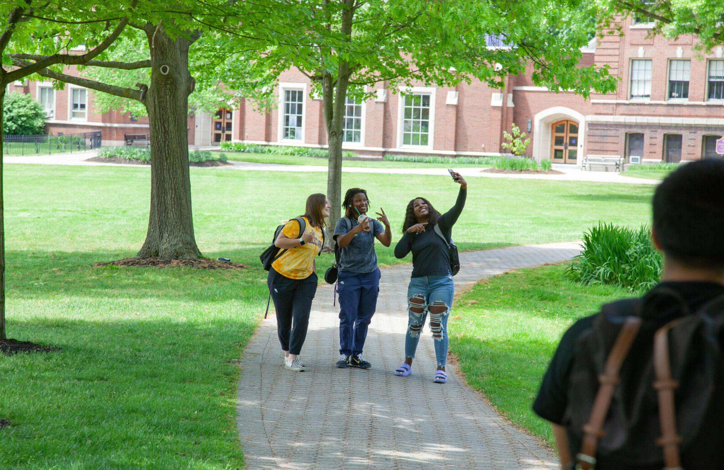 Students take a selfie on campus